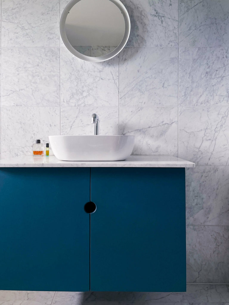 Modern blue MDF bathroom in the apartment renovation.